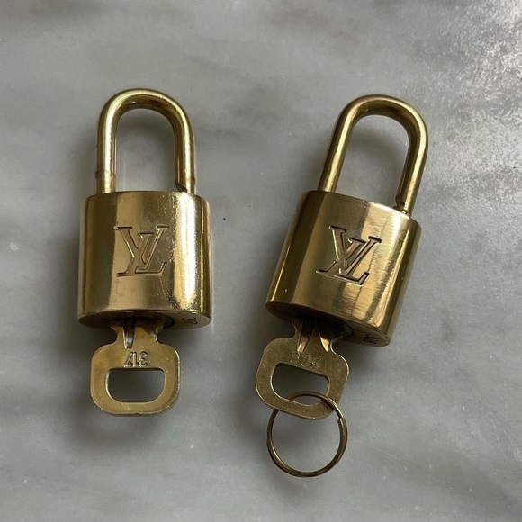 Louis Vuitton Handbags - 🌿authentic Louis Vuitton bundle of 2 locks.